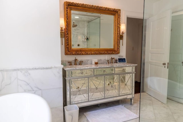 bathroom with double vanity, a sink, and a shower with shower door