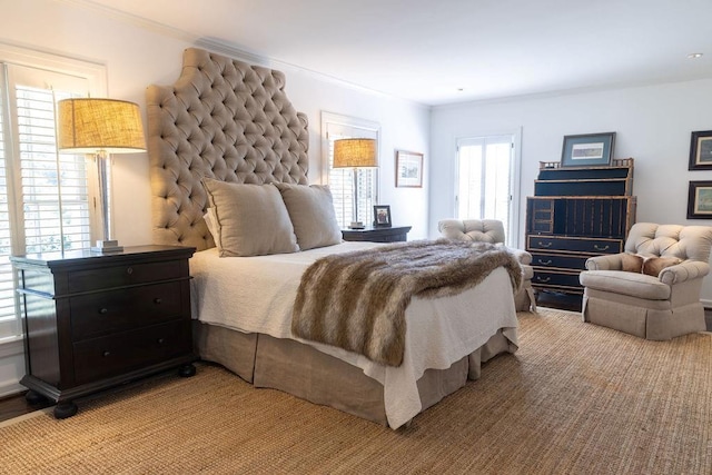 bedroom featuring multiple windows and ornamental molding