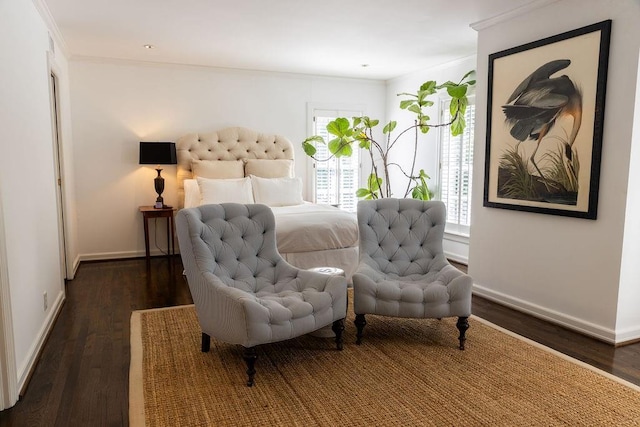 bedroom with dark wood-type flooring and baseboards