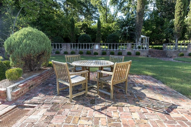 view of patio featuring outdoor dining space and fence