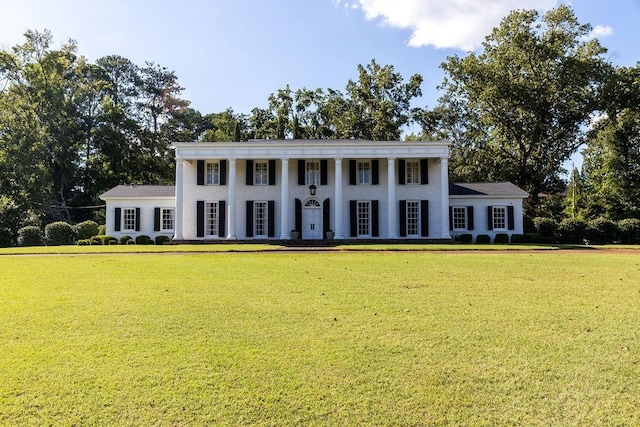 greek revival house featuring a front lawn