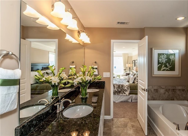 5268 Mulberry Pass Ct, Hoschton, GA 30548 - ensuite bathroom with double vanity, a bath, and tile patterned flooring