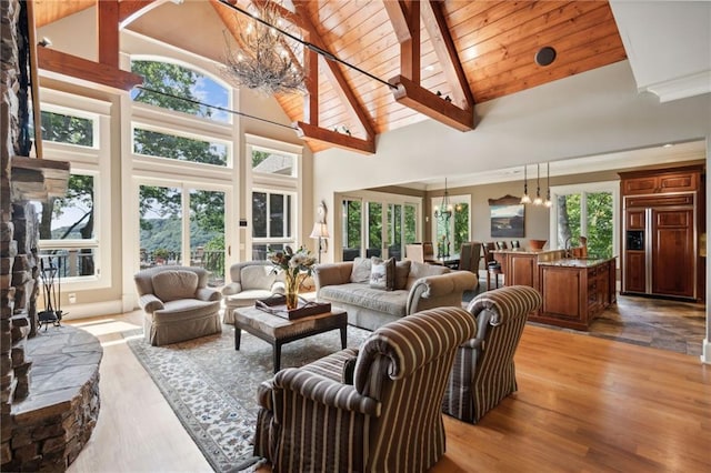 living room with a healthy amount of sunlight and high vaulted ceiling