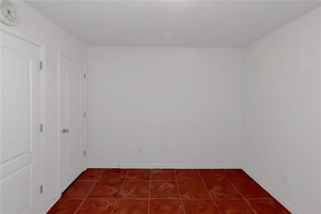 11354 Conner Ct, Hampton, GA 30228 - unfurnished room with dark tile patterned floors and a smoke detector