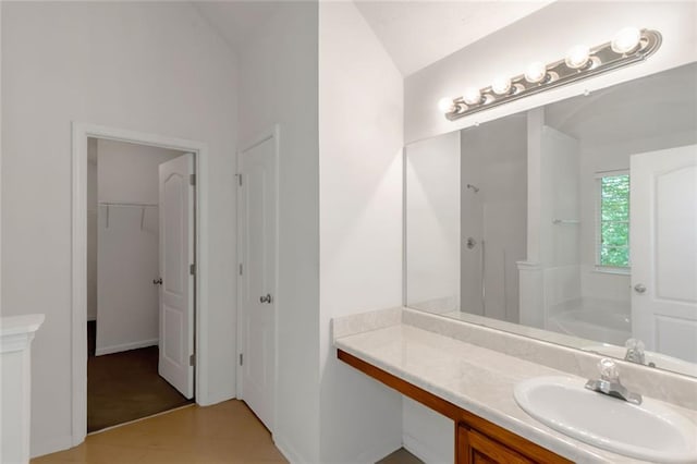 11354 Conner Ct, Hampton, GA 30228 - bathroom with lofted ceiling, vanity, a shower, a bath, and a walk in closet