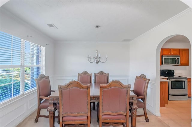 11354 Conner Ct, Hampton, GA 30228 - dining space featuring a chandelier, plenty of natural light, ornamental molding, a decorative wall, and a wainscoted wall