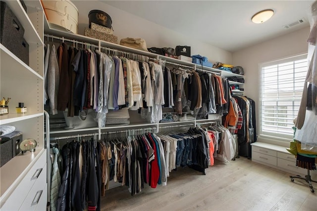 spacious closet with light wood-type flooring and visible vents