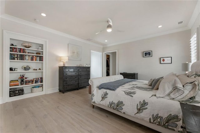 bedroom with visible vents, a ceiling fan, light wood finished floors, and crown molding