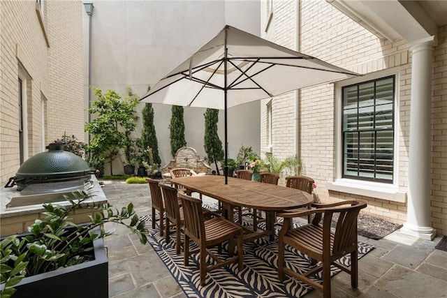 view of patio featuring outdoor dining area and grilling area