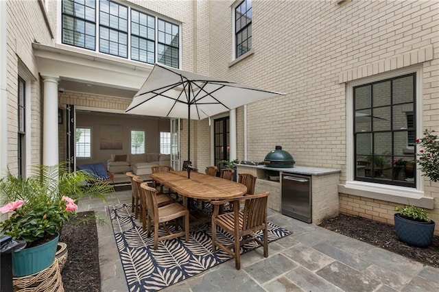 view of patio with outdoor dining area, a grill, area for grilling, and outdoor lounge area