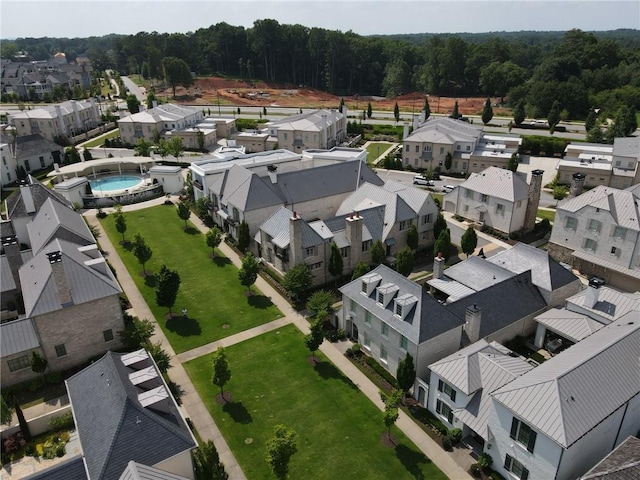 birds eye view of property with a residential view