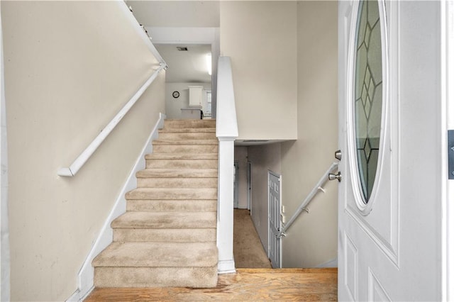 stairway with wood-type flooring