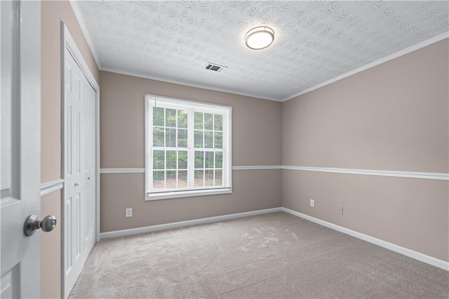 356 Chardonnay Trce, Braselton, GA 30517 - unfurnished bedroom featuring a closet, carpet flooring, a textured ceiling, and ornamental molding