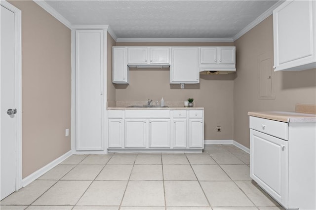 356 Chardonnay Trce, Braselton, GA 30517 - kitchen featuring white cabinetry, light countertops, crown molding, a textured ceiling, and light tile patterned floors