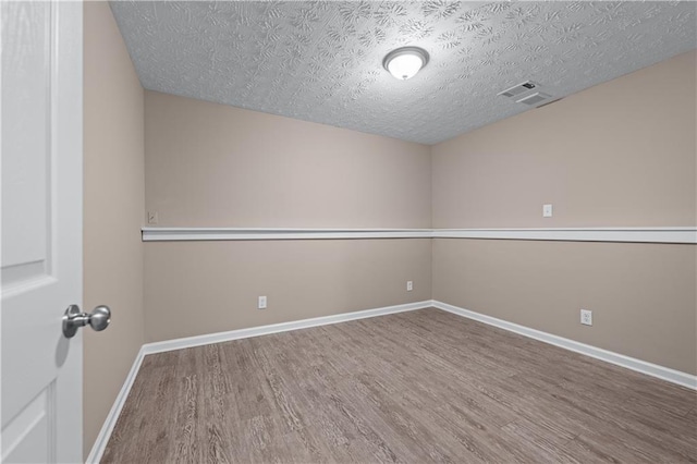 356 Chardonnay Trce, Braselton, GA 30517 - empty room featuring wood finished floors and a textured ceiling