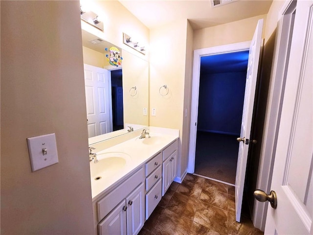 full bathroom featuring visible vents, a sink, and double vanity