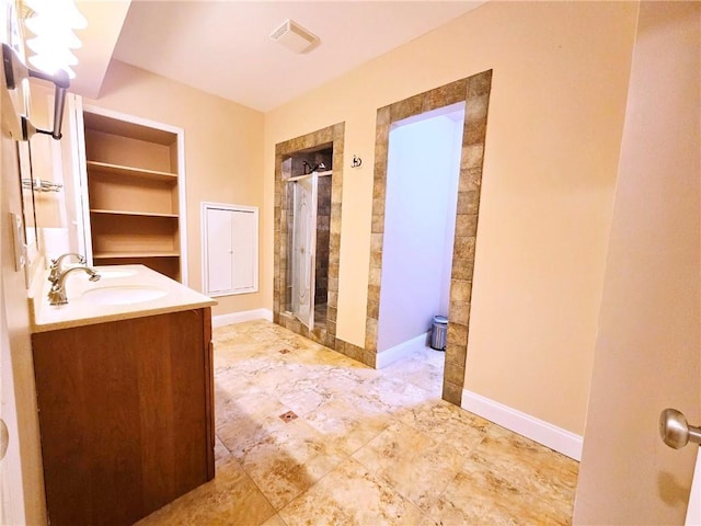 full bath with built in features, vanity, visible vents, and a stall shower
