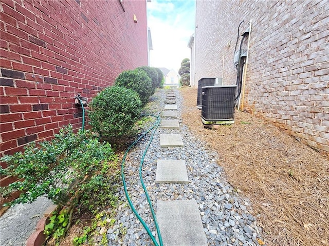 view of yard with central air condition unit