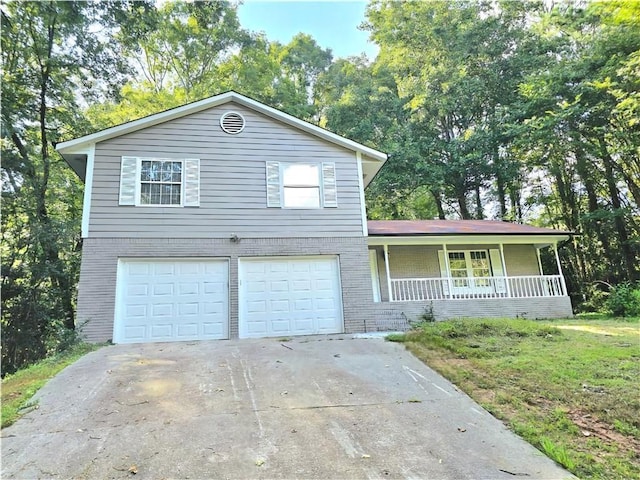 view of front of house featuring a garage and covered porch