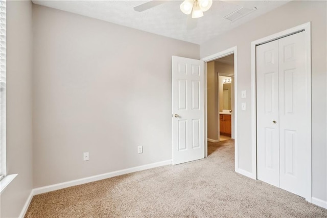 carpeted office with a textured ceiling