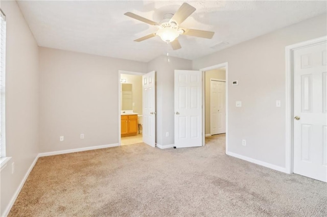 unfurnished room with ceiling fan and carpet floors