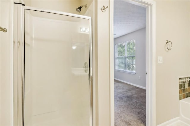 bathroom with a textured ceiling, vanity, tile patterned floors, and a tub