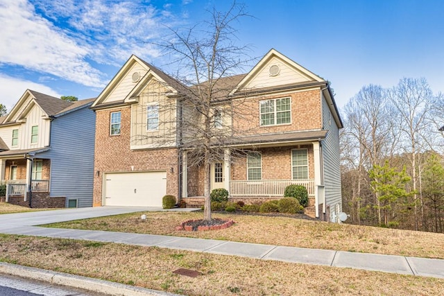 view of front of property featuring a garage, brick siding, covered porch, and driveway