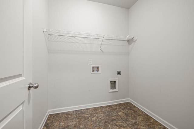 clothes washing area with laundry area, hookup for a washing machine, hookup for an electric dryer, and baseboards