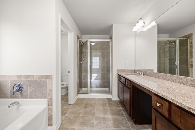 full bath featuring toilet, a stall shower, vanity, and a bath