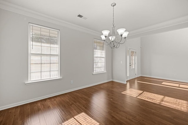 spare room featuring a notable chandelier, baseboards, visible vents, and wood-type flooring