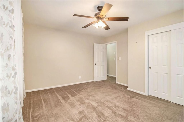 unfurnished bedroom with a closet, ceiling fan, and carpet floors