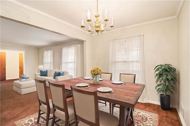 dining area featuring a notable chandelier and crown molding