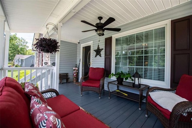 wooden deck featuring ceiling fan