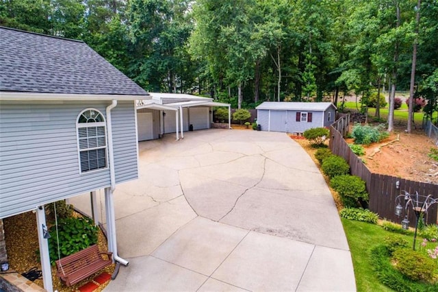 view of front of property featuring a garage and an outdoor structure