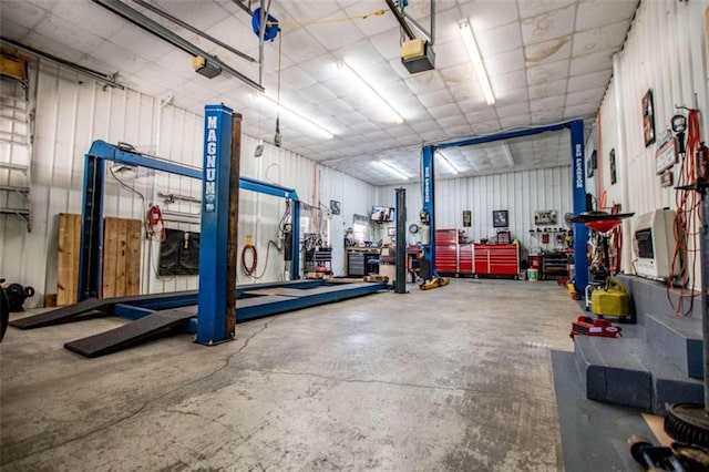 garage featuring a workshop area and a garage door opener