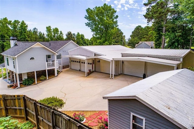 back of property with a garage