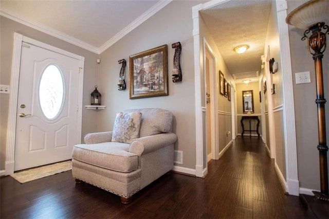 entrance foyer with vaulted ceiling, crown molding, and dark wood-type flooring