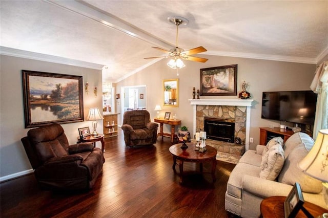 living room with vaulted ceiling, dark hardwood / wood-style floors, a fireplace, ceiling fan, and ornamental molding