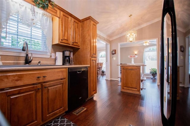 kitchen with crown molding, dark hardwood / wood-style floors, decorative light fixtures, dishwasher, and vaulted ceiling