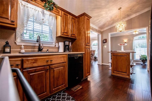 kitchen featuring pendant lighting, dark wood-type flooring, black dishwasher, ornamental molding, and lofted ceiling