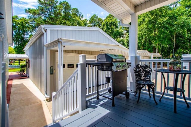 wooden deck with a grill