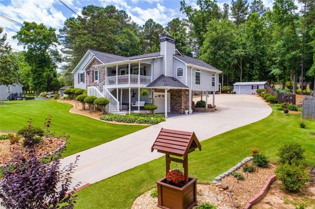 rear view of house with a yard and a porch