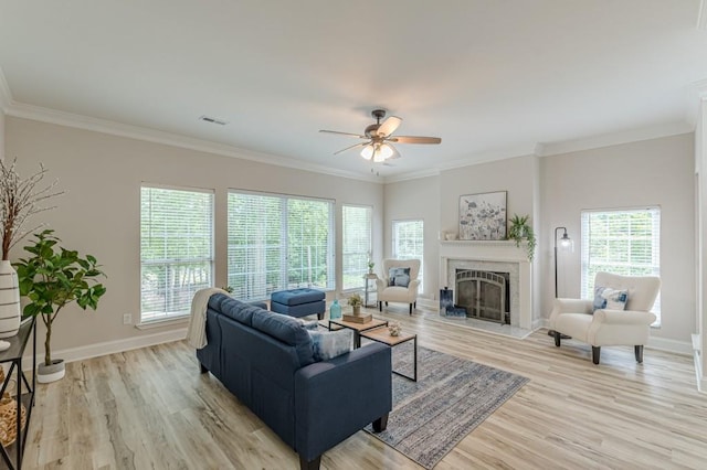 3329 Walt Stephens Rd, Stockbridge, GA 30281 - living room with ceiling fan, a fireplace, light wood finished floors, and crown molding