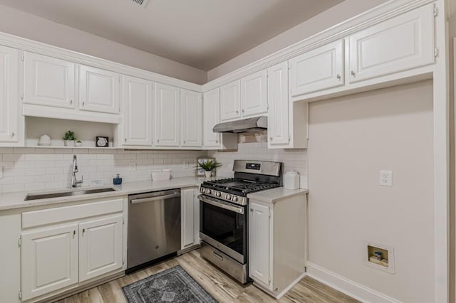 3329 Walt Stephens Rd, Stockbridge, GA 30281 - kitchen with appliances with stainless steel finishes, light wood finished floors, and light countertops