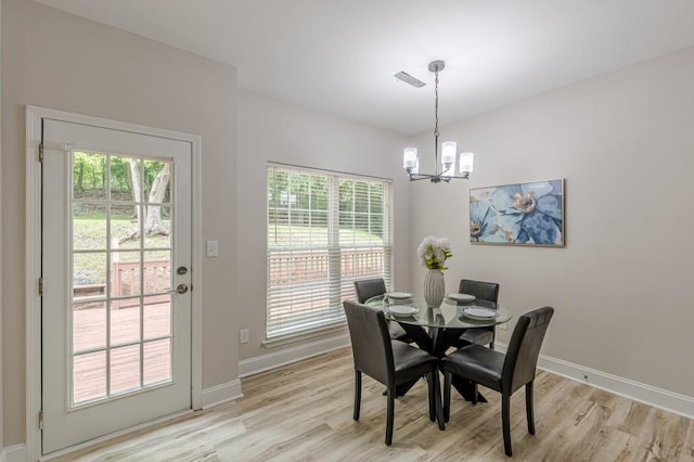 3329 Walt Stephens Rd, Stockbridge, GA 30281 - dining space featuring a chandelier and light wood finished floors