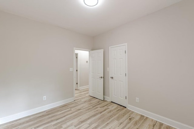 3329 Walt Stephens Rd, Stockbridge, GA 30281 - unfurnished bedroom featuring light wood-style floors and baseboards