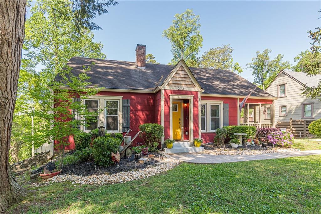 2733 Winburn Ter, East Point, GA 30344 - view of front of home featuring a front lawn and a chimney