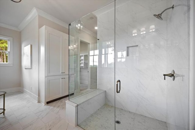 bathroom with a stall shower, marble finish floor, crown molding, and baseboards