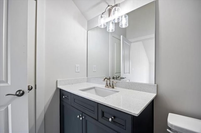 half bath with vanity and toilet