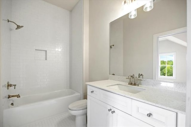 full bath featuring washtub / shower combination, tile patterned flooring, vanity, and toilet